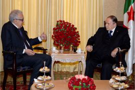 A handout picture released on October 8, 2014 by the official Algeria Press Service (APS) shows Algerian President Abdulaziz Bouteflika (R) meeting with Algeria's veteran diplomat Lakhdar Brahimi in the capital Algiers. Bouteflika, 77, on Saturday, in a break from tradition, stayed away from public Eid al-Adha prayers marking the end of the annual hajj pilgrimage to Mecca. AFP PHOTO/HO/APS == RESTRICTED TO EDITORIAL USE - MANDATORY CREDIT "AFP PHOTO / HO / APS" - NO MARKETING NO ADVERTISING CAMPAIGNS - DISTRIBUTED AS A SERVICE TO CLIENTS ===