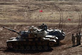 Turkish soldiers supported by tanks guard the Turkish-Syrian border, Suruc district, Sanliurfa, Turkey, 23 October 2014. As the Pentagon admits one of the airdrops containing humanitarian and military supplies it has been delivering to Syrian Kurdish fighters in Kobane may have ended up in the hands of IS, talks which have been ongoing in the Kurdish north of Iraq between Syrian and Iraqi Kurdish groups have said they are prepared to cooperate and the Kurdish Regional Government hopes to support the ongoing battle in Kobane with troops.
