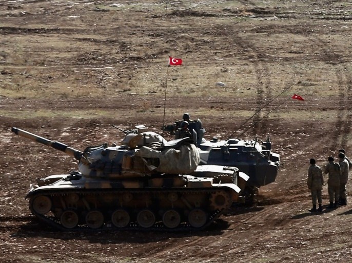 Turkish soldiers supported by tanks guard the Turkish-Syrian border, Suruc district, Sanliurfa, Turkey, 23 October 2014. As the Pentagon admits one of the airdrops containing humanitarian and military supplies it has been delivering to Syrian Kurdish fighters in Kobane may have ended up in the hands of IS, talks which have been ongoing in the Kurdish north of Iraq between Syrian and Iraqi Kurdish groups have said they are prepared to cooperate and the Kurdish Regional Government hopes to support the ongoing battle in Kobane with troops.