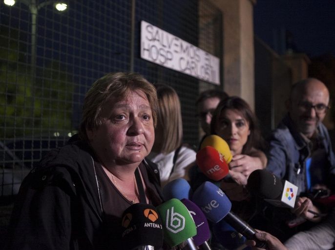 Teresa Mesa, left, spokesperson of Ebola patient Teresa Romero speaks to the media in front of the Carlos III Hospital in Madrid, Spain, Sunday, Oct. 19, 2014. Spain says a test has shown a nursing assistant who became infected with Ebola is now clear of all traces of the virus. A blood test has revealed that Teresa Romero's immune system has eliminated the virus from her body, according to a statement released by Prime Minister Mariano Rajoy's office late Sunday. Romero, 44, had treated two patients who died of Ebola at Carlos III hospital. The first, Miguel Pajares, contracted the disease in Liberia and died on Aug. 12 despite having been treated with the experimental drug ZMapp. The second was Manuel Garcia Viejo who died, aged 69, on Sept. 25. (AP Photo/Gabriel Pecot)