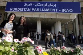 Female Kurdish deputies are pictured outside the Kurdistan parliament building in Arbil, the capital of the autonomous Kurdish region of northern Iraq on November 6, 2013, following the first parliamentary meeting of the recently elected deputies. AFP PHOTO/SAFIN HAMED