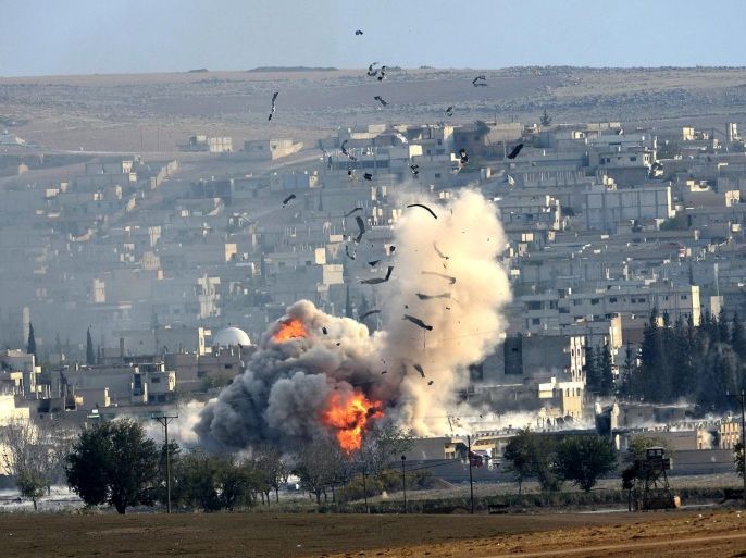 An explosion after an apparent US-led coalition airstrike on Kobane, Syria, as seen from the Turkish side of the border, near Suruc district, Sanliurfa, Turkey, 27 October 2014. Kurdish rebels have regained a strategic hill in the town of Kobane in northern Syria from the Islamic State after heavy airstrikes by the US-led coalition against the militant group, the Kurdish Rudaw news agency have reported. The United States and Arab allies have intensified their aerial campaign against the Islamic State in Kobane after the radical group gained ground around the mostly Kurdish town in recent days.