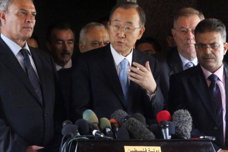 United Nations Secretary-General Ban Ki-moon (C) speaks to the media during his visit to the headquarters of the Palestinian cabinet in Gaza City October 14, 2014. Ban Ki-moon lamented the vast destruction in Gaza as he visited the area on Tuesday for the first time since the war, calling the situation "beyond description" and urging a speedy reconstruction effort. He also announced that Israel was permitting a first truckload of construction materials to enter the enclave, which has been blockaded by Israel and Egypt since before the conflict. REUTERS/Ibraheem Abu Mustafa (GAZA - Tags: POLITICS CIVIL UNREST)