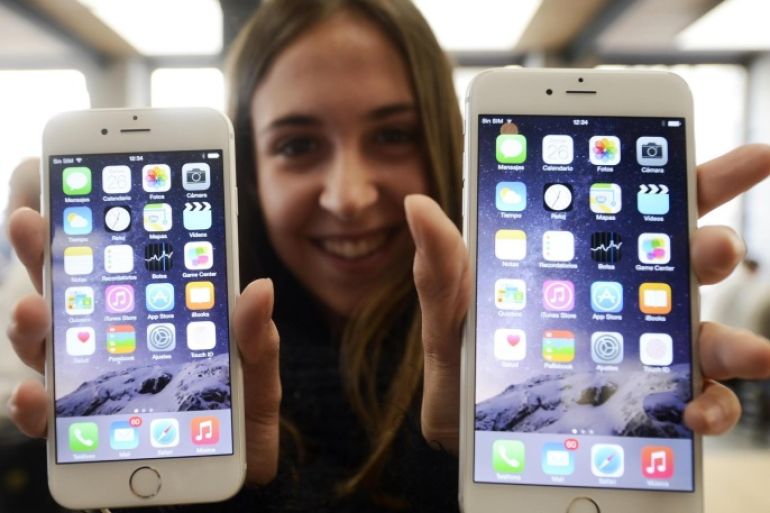 MADRID, SPAIN - SEPTEMBER 26: A customer shows the new products of Apple, iPhone 6 and iPhone 6 Plus, at an Apple Store in Madrid, Spain, on September 26, 2014. The iPhone 6 and iPhone 6 Plus were launched on September 19, 2014 in the United States, Britain, Australia, Canada, France, Germany, Hong Kong, Japan, Puerto Rico and Singapore.