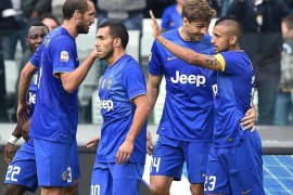 Juventus' Arturo Vidal (R) jubilates with his teammates after scoring the goal during the Italian Serie A soccer match Juventus FC vs US Palermo at Juventus Stadium in Turin, Italy, 26 October 2014.