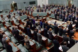 epa04320409 Members of Parliament, including Australian prime minister Tony Abbott, stand as a mark of respect for the deaths in the Malaysia Airlines MH17 plane crash in Ukraine,