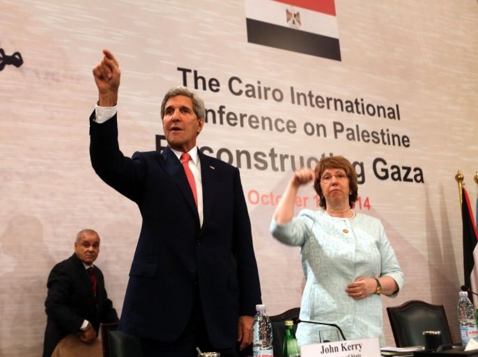 US Secretary of State John Kerry (L) and EU Foreign Policy Chief Catherine Ashton (R) attend the International donors conference on financing the reconstruction of the Gaza Strip in Cairo, Egypt, 12 October 2014. Foreign ministers and senior officials from dozens of countries met in Cairo on 12 October for a donors' conference to help reconstruct theGaza Strip, devastated by 50 days of conflict with Israel this summer. The Palestinian Authority puts the cost of reconstruction at 4 billion dollars and says it will need another 4.5 billion in ongoing budget support for Gaza between now and 2017.