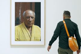 A man looks at a portrait of Spanish painter Pablo Picasso by US photographer David Douglas Duncan displayed at his photography exhibition at the Picasso Museum in Barcelona, Spain, 02 October 2014. Up to 163 photographs of David Douglas Duncan, will be from today shown at the museum.