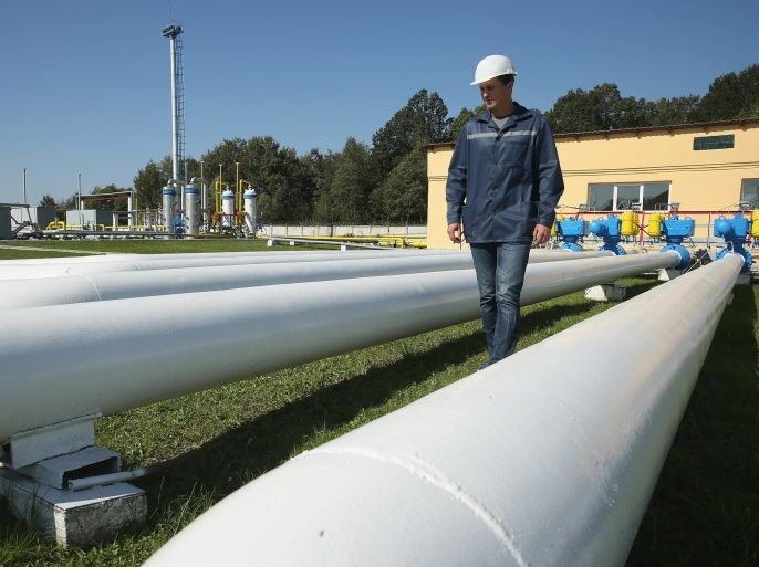 DASHAVA, UKRAINE - SEPTEMBER 18: A worker, at the request of the photographer, walks among pipes at the Dashava natural gas facility on September 18, 2014 in Dashava, Ukraine. The Dashava facility, which is both an underground storage site for natural gas and an important transit station along the natural gas pipelines linking Russia, Ukraine and eastern and western Europe, is operated by Ukrtransgaz, a subsidiary of Ukrainian energy company NJSC Naftogaz of Ukraine. Ukraine recently began importing natural gas from Slovakia through Dashava as Ukraine struggles to cope with cuts in gas deliveries by Gazprom of Russia. As Russia has cut supplies many countries in Europe that rely heavily on Russian gas fear that Russia will increasingly use gas delivery cuts as a political weapon to counter European economic sanctions arising from Russian involvement in fighting between pro-Russian separatists and Ukrainian armed forces in eastern Ukraine.