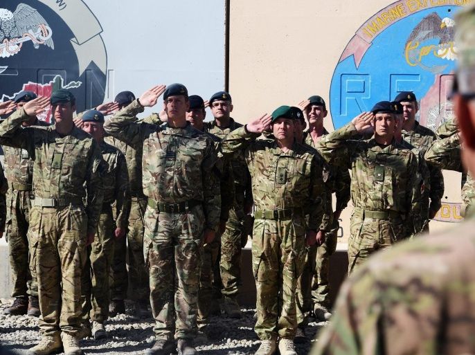 A handout image made available by British Defence Ministry, MOD, dated 26 October 2014 and showing British soldiers and US Marine Corps (USMC) soldiers attending the ceremony of the British, US and NATO flags being lowered at the Camp Bastion-Leatherneck camp complex for the last time in Afghanistan. British Armed Forces have ended combat operations in Helmand Province in Afghanistan, paving the way for the final transfer of security to the Afghan National Security Forces (ANSF).The ceremony was alo attended by troops of Afghan National Security Forces (ANSF). The ceremony marks the end of operations for Regional Command (Southwest), a British and US coalition command under the umbrella of NATOs International Security Assistance Force (ISAF). Other contributing nations have included Denmark, Estonia, Georgia, Tonga, Jordan and Bosnia. EPA/SERGEANT OBI IGBO, RLC / MOD / HANDOUT