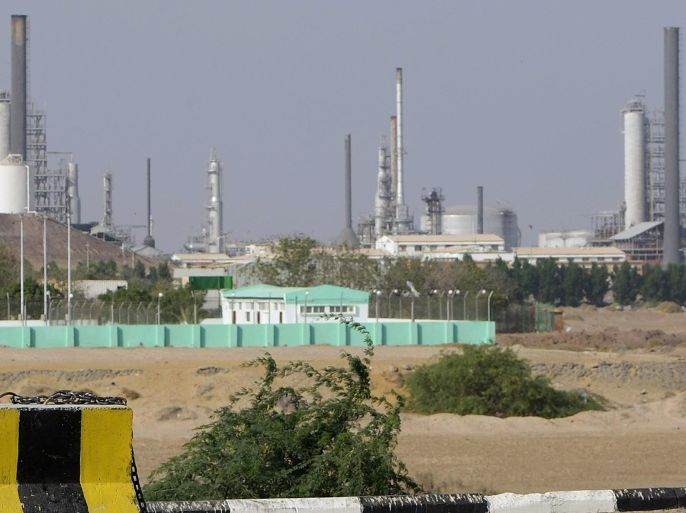 A security guard keeps watch outside an oil refinery in the Yemeni southern city of Aden on November 24, 2010 as Yemen hosts the 20th Gulf Cup football championship amid tight security.