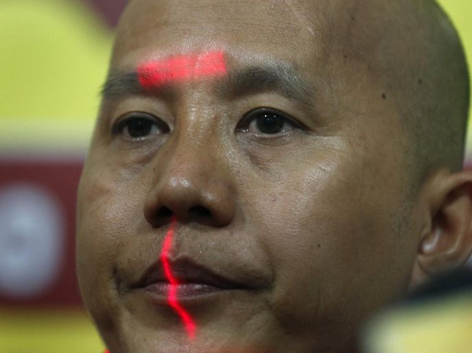 Buddhist monk Ashin Wirathu looks on during a news conference in Colombo September 30, 2014. A Myanmar monk, Wirathu, accused of inciting violence against Muslims and a hardline Buddhist group in Sri Lanka said on Tuesday they would work together to rally other Buddhist groups and defend their faith against militant Islamists. Wirathu, who once called himself "the Burmese bin Laden" said the agreement with Sri Lanka's Bodu Bala Sena (BBS) or "Buddhist Power Force," was the first step in a broad alliance against conversions by Islamists in the region. REUTERS/Dinuka Liyanawatte (SRI LANKA - Tags: RELIGION POLITICS CIVIL UNREST)