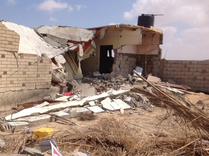 A general view of damaged buildings and houses is seen on September 3, 2013 in the village of al-Toma after it was hit during an Egyptian army operation on September 3, 2013 on the outskirts of Egypt's northern Sinai town of Sheikh Zuweid. Egypt military helicopters killed eight militants and wounded 15 others in intensive air strikes in the Sinai Peninsula, where the army has been battling a semi-insurgency, security sources said.