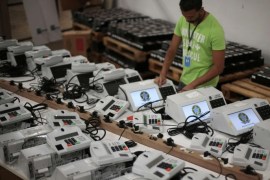 A worker prepares an electronic voting machine at the electoral tribune in Brasilia September 24, 2014. The first round presidential election will take place across Brazil on October 5, 2014. REUTERS/Ueslei Marcelino (BRAZIL - Tags: POLITICS ELECTIONS)