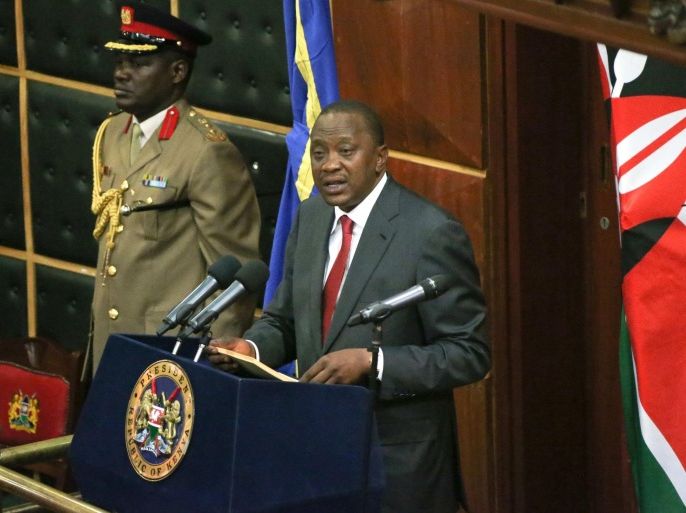 Kenya's President Uhuru Kenyatta addresses a special Parliamentary session at Parliament Building in the capital Nairobi October 6, 2014. Kenya's president said on Monday he would attend a hearing at the International Criminal Court this week, the first sitting world leader to appear in The Hague-based court, although he said he would be going in a personal capacity. Kenyatta told parliament he would appoint his deputy, William Ruto, as acting president in his absence to avoid putting the "sovereignty of more than 40 million Kenyans on trial" and would not attend in his position as head of state. REUTERS/PSCU/Handout via Reuters (KENYA - Tags: POLITICS CRIME LAW) FOR EDITORIAL USE ONLY. NOT FOR SALE FOR MARKETING OR ADVERTISING CAMPAIGNS. THIS IMAGE HAS BEEN SUPPLIED BY A THIRD PARTY. IT IS DISTRIBUTED, EXACTLY AS RECEIVED BY REUTERS, AS A SERVICE TO CLIENTS