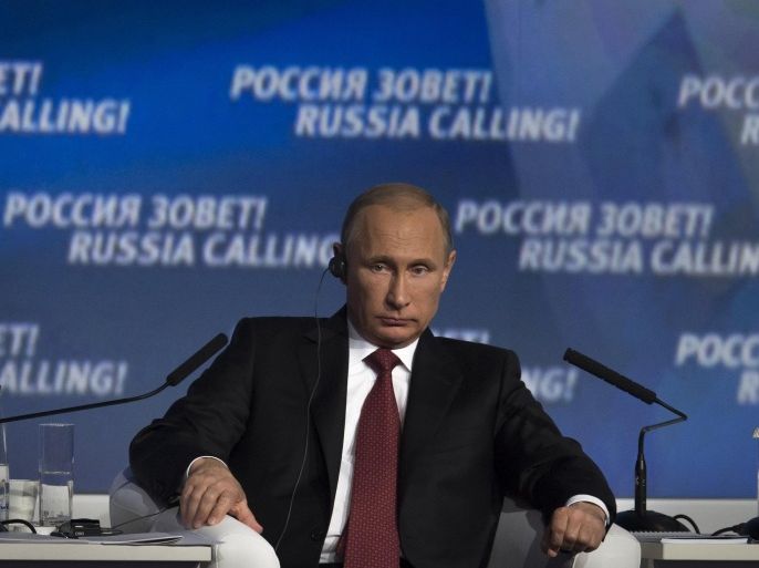Russian President Vladimir Putin listens during an investment conference Russia Calling in Moscow on Thursday, Oct. 2, 2014. (AP Photo/Ivan Sekretarev)