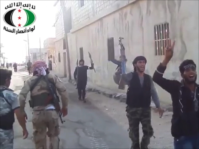صورة بثها ناشطون لسيطرة الثوار على قرية دير عدس بريف درعا