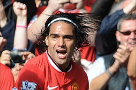 epa04432986 Manchester United's Radamel Falcao (R) celebrates after scoring the 2-1 goal during the English Premier League soccer match between Manchester United and Everton at the Old Trafford in Manchester, Britain, 05 October 2014. EPA/PETER POWELL DataCo terms and conditions apply