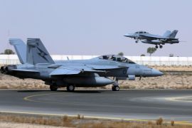 A Royal Australian Air Force (RAAF) F/A-18F Super Hornet takes off as another taxis along the runway as they start their first combat mission over Iraq in this picture released by the Australian Defence Force October 6, 2014. Australian fighter jets have been authorised to begin striking Islamic State insurgents in Iraq, Prime Minister Tony Abbott said on Friday, joining a U.S.-led coalition that aims to roll back gains by the insurgent group in the Middle East. Picture taken October 5, 2014 REUTERS/Australian Defence Force/Handout (Tags: MILITARY TRANSPORT) ATTENTION EDITORS - THIS PICTURE WAS PROVIDED BY A THIRD PARTY. REUTERS IS UNABLE TO INDEPENDENTLY VERIFY THE AUTHENTICITY, CONTENT, LOCATION OR DATE OF THIS IMAGE. THIS PICTURE IS DISTRIBUTED EXACTLY AS RECEIVED BY REUTERS, AS A SERVICE TO CLIENTS. NO SALES. NO ARCHIVES. FOR EDITORIAL USE ONLY. NOT FOR SALE FOR MARKETING OR ADVERTISING CAMPAIGNS