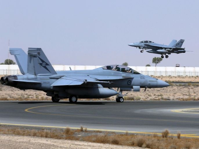 A Royal Australian Air Force (RAAF) F/A-18F Super Hornet takes off as another taxis along the runway as they start their first combat mission over Iraq in this picture released by the Australian Defence Force October 6, 2014. Australian fighter jets have been authorised to begin striking Islamic State insurgents in Iraq, Prime Minister Tony Abbott said on Friday, joining a U.S.-led coalition that aims to roll back gains by the insurgent group in the Middle East. Picture taken October 5, 2014 REUTERS/Australian Defence Force/Handout (Tags: MILITARY TRANSPORT) ATTENTION EDITORS - THIS PICTURE WAS PROVIDED BY A THIRD PARTY. REUTERS IS UNABLE TO INDEPENDENTLY VERIFY THE AUTHENTICITY, CONTENT, LOCATION OR DATE OF THIS IMAGE. THIS PICTURE IS DISTRIBUTED EXACTLY AS RECEIVED BY REUTERS, AS A SERVICE TO CLIENTS. NO SALES. NO ARCHIVES. FOR EDITORIAL USE ONLY. NOT FOR SALE FOR MARKETING OR ADVERTISING CAMPAIGNS