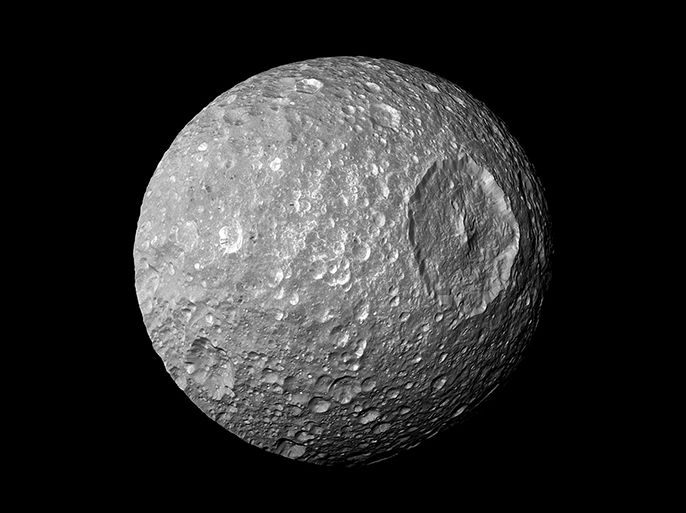 The Saturn moon Mimas is seen in an image from NASA's Cassini spacecraft taken at a distance of about 9,500 kilometers (5,900 miles) February 13, 2010. Saturn's battered moon Mimas may sport a thin global ocean buried miles beneath its icy surface, raising the prospect of another life-friendly habitat in the solar system, scientists said on Thursday. REUTERS/NASA/JPL-Caltech/Space Science Institute/Handout via Reuters (OUTER SPACE - Tags: SCIENCE TECHNOLOGY) THIS IMAGE HAS BEEN SUPPLIED BY A THIRD PARTY. IT IS DISTRIBUTED, EXACTLY AS RECEIVED BY REUTERS, AS A SERVICE TO CLIENTS. FOR EDITORIAL USE ONLY. NOT FOR SALE FOR MARKETING OR ADVERTISING CAMPAIGNS