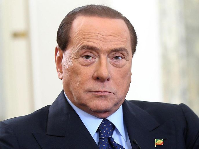 الموسوعة - epa04190951 Former Italian Prime Minister Silvio Berlusconi is pictured during an interview with Rai 3, in Milan, Italy, 04 May 2014. EPA/MATTEO BAZZI