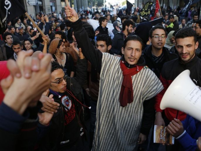 Anti-government protesters from the "20th February, the Moroccan Arab Spring Movement", shout during a rally in Rabat, Morocco, Sunday Jan. 26, 2014. Demonstrators protested calling for the fall of the government because of its failure to address unemployment and rising prices. (AP Photo/Abdeljalil Bounhar)