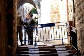 JERUSALEM, ISRAEL - OCTOBER 30: Israeli security forces stand guard at a gate of Al-Aqsa compound, closed to all Muslims by Israeli authorities following shooting of a Jewish rabbi, for the first time since 1967, in Jerusalem, Israel on October 30, 2014.