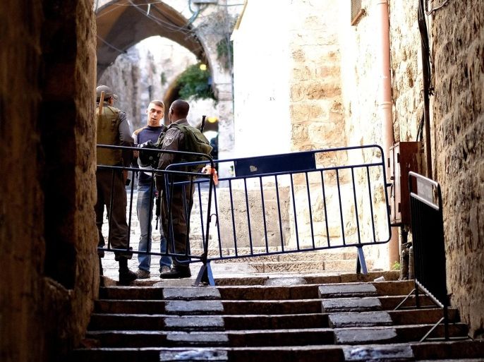 JERUSALEM, ISRAEL - OCTOBER 30: Israeli security forces stand guard at a gate of Al-Aqsa compound, closed to all Muslims by Israeli authorities following shooting of a Jewish rabbi, for the first time since 1967, in Jerusalem, Israel on October 30, 2014.