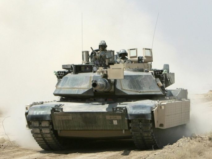 A U.S. M1A1 Abrams tank moves forward during a live fire demonstration for Iraqi government officials at Besmaya Combat Training Center in the outskirts of Baghdad August 17, 2008.