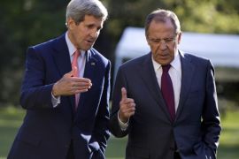 U.S. Secretary of State John Kerry, left, and Russian Foreign Minister Sergey Lavrov talk as they walk together on the grounds of the Chief of Mission Residence in Paris, France, Tuesday, Oct. 14, 2014. The top U.S. and Russian diplomats are hoping to find a way to begin reversing a yearlong spike in tensions stemming from Ukraine's revolution and civil war. (AP Photo/Carolyn Kaster, Pool)