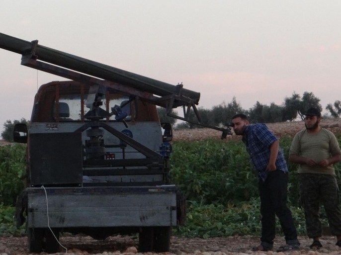 ALEPPO, SYRIA - OCTOBER 08: Members of the anti-regimist Mujahideen brigade and Ahrar al-Sham brigade check the missile launcher during the joint operation named 'Zair' against Syrian Regime forces in southern region of Aleppo, Syria on October 08, 2014.