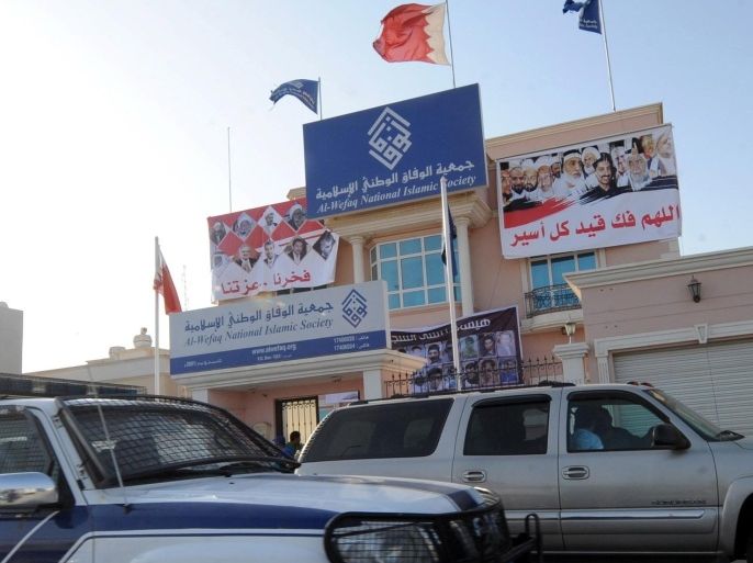 (FILE) A file photo dated 04 October 2011 showing a anti-riot police car passing in-front of the headquarters of the largest Shiite opposition group, Al-Wefaq, on the outskirts of Manama, Bahrain. A Bahraini court on 28 October 2014 ordered that the countryâs leading opposition grouping, Al-Wefaq, be suspended for three months. The second largest grouping of the opposition coalition, Waad, will have its fate determined on 09 November 2014 as the court accepted a motion by the government to have time to study the defense presented by Waad. The Ministry of Justice in late July filed a court case against the two parties accusing them of failing to meet the regulations governing the political parties. The sue came at the height of a dead-lock in talks between the regime and the opposition groups over demands for democratic reforms. Al-Wefaq, representing the Muslim Shiite wing of the opposition, and Waad, representing the liberal Pan-Arab wing, were both accused of failing to hold proper general assemblies which according to the authorities nullified their boards. EPA/MAZEN MAHDI *** Local Caption *** 50065768