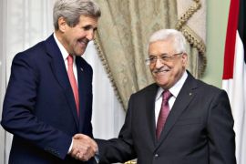 U.S. Secretary of State John Kerry shakes hands with Palestinian President Mahmoud Abbas (R) at Andalus Villa in Cairo October 12, 2014, on the sidelines of the Gaza Donor Conference. REUTERS/Carolyn Kaster/Pool (EGYPT - Tags: POLITICS)