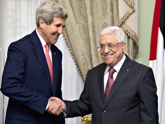 U.S. Secretary of State John Kerry shakes hands with Palestinian President Mahmoud Abbas (R) at Andalus Villa in Cairo October 12, 2014, on the sidelines of the Gaza Donor Conference. REUTERS/Carolyn Kaster/Pool (EGYPT - Tags: POLITICS)
