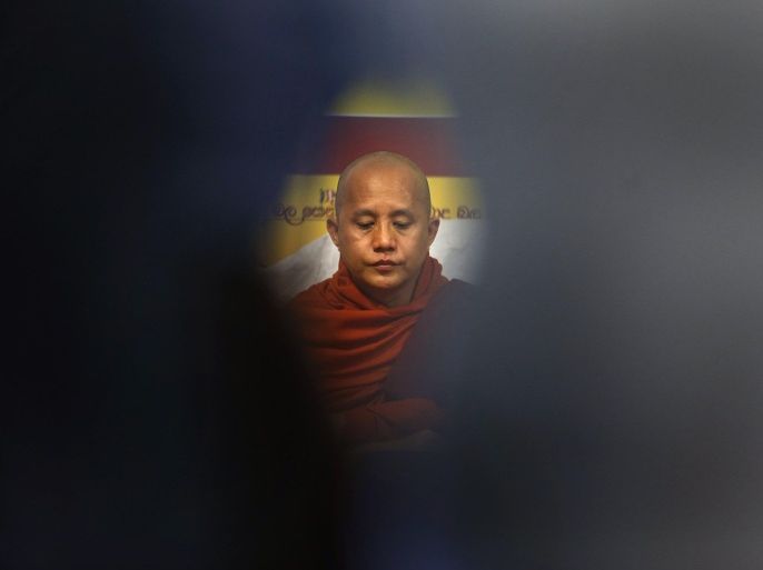 Buddhist monk Ashin Wirathu looks on during a news conference in Colombo September 30, 2014. A Myanmar monk, Wirathu, accused of inciting violence against Muslims and a hardline Buddhist group in Sri Lanka said on Tuesday they would work together to rally other Buddhist groups and defend their faith against militant Islamists. Wirathu, who once called himself "the Burmese bin Laden" said the agreement with Sri Lanka's Bodu Bala Sena (BBS) or "Buddhist Power Force," was the first step in a broad alliance against conversions by Islamists in the region. REUTERS/Dinuka Liyanawatte (SRI LANKA - Tags: RELIGION POLITICS CIVIL UNREST)