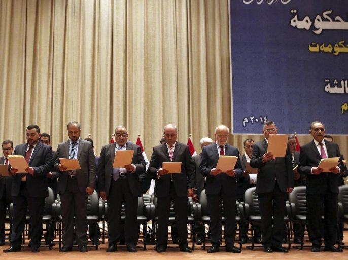 New Iraqi government officials participate in a swearing-in ceremony in Baghdad September 8, 2014. Iraq's parliament approved a new government headed by Haider al-Abadi as prime minister on Monday night, in a bid to rescue Iraq from collapse, with sectarianism and Arab-Kurdish tensions on the rise. REUTERS/Hadi Mizban/Pool (IRAQ - Tags: POLITICS)