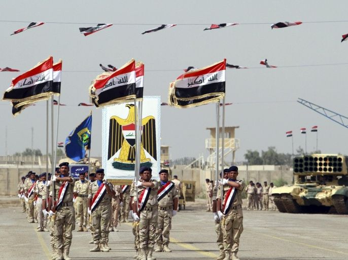 Iraqi Army soldiers march as part of a parade marking the founding anniversary of the army's artillery section in Baghdad October 1, 2014. REUTERS/Mahmoud Raouf Mahmoud (IRAQ - Tags - Tags: MILITARY ANNIVERSARY)