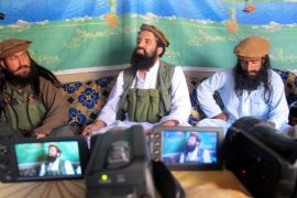 A picture made available on 15 October 2014 shows Shahidullah Shahid (C), the spokesman of Pakistani Talibans speaking to journalists at an undisclosed location near the Pak-Afghan border, 21 February 2014. Five Taliban commanders in Pakistan and their spokesman announced formal allegiance on 15 October to the Islamic State militant group, in a blow to al-Qaeda's dominance in the region. Spokesman Shahidullah Shahid said he had accepted the leadership of the Islamic State chief, Abu Bakr al-Baghdadi, whose group has taken over large swatches of territory in Iraq and Syria.