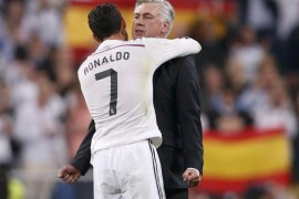 Real Madrid's Cristiano Ronaldo (7) embraces his coach Carlo Ancelotti after their Spanish first division "Clasico" soccer match against Barcelona at the Santiago Bernabeu stadium in Madrid October 25, 2014. REUTERS/Juan Medina (SPAIN - Tags: SOCCER SPORT TPX IMAGES OF THE DAY)