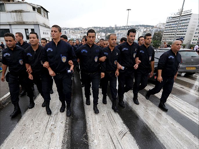 epa04446651 Algerian policemen march during a protest in Algiers, Algeria, 14 October 2014. According to media reports about 400 police officers demonstrated in Algiers demanding better working conditions, the creation of a union as well as the departure of General Abdelghani Hamel, appointed head of the national police in July 2010, on previous occasions the Government has supressed such protests as by law members of the security services are not allowed to protest. EPA/STR