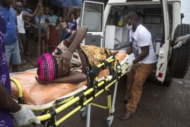 A pregnant woman suspected of contracting Ebola is lifted by stretcher into an ambulance in Freetown, Sierra Leone September 19, 2014 in a handout photo provided by UNICEF. Sierra Leone's army has "sealed off" the borders with Liberia and Guinea in a bid to halt the spread of Ebola, the army spokesman said on September 23, 2014. The spokesman told Reuters that troops had been sent to all border crossing points.REUTERS/Bindra/UNICEF/handout via Reuters (SIERRA LEONE - Tags: HEALTH DISASTER POLITICS TPX IMAGES OF THE DAY) FOR EDITORIAL USE ONLY. NOT FOR SALE FOR MARKETING OR ADVERTISING CAMPAIGNS. THIS IMAGE HAS BEEN SUPPLIED BY A THIRD PARTY. IT IS DISTRIBUTED, EXACTLY AS RECEIVED BY REUTERS, AS A SERVICE TO CLIENTS