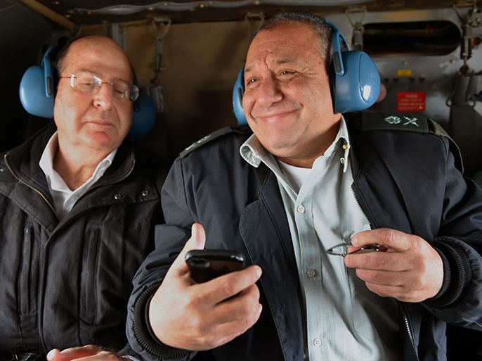 epa04508531 A photograph supplied by the Israeli Defense Ministry and distributed on 29 November 2014 shows Maj. Gen. Gadi Eizenkot (R) in a military helicopter with Israeli Defense Minister Moshe Ya'alon (L) flying over Israel, on 27 November 2014, on the day Eizenkot was tapped to become Israel's next Chief of Staff, or top soldier. Eizenkot, 54, is from the Golani Brigades. EPA/ISRAELI DEFENSE FORCES (IDF)/HANDOUT HANDOUT EDITORIAL USE ONLY/NO SALES