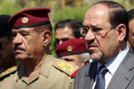 Iraqi Prime Minister Nuri al-Maliki (2nd R) and Lieutenant General Abboud Qanbar (2nd L) attend the funeral ceremony of Gen. Majid Abdul Salam, at the defence ministry in Baghdad in this August 13, 2014 file photo. To match Special Report MIDEAST-CRISIS/GHARAWI REUTERS/Stringer/Files (IRAQ - Tags: MILITARY POLITICS)