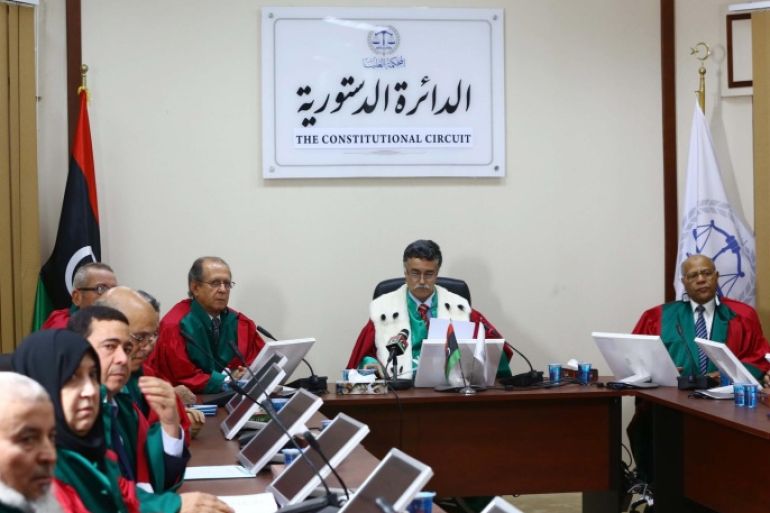 Judges of Libya's supreme court discuss the legitimacy of the country's internationally recognised parliament during a hearing on November 6, 2014 in the capital Tripoli. The court invalidated the parliament, news agency LANA reported, setting the stage for more political chaos in the violence-wracked nation. AFP PHOTO / MAHMUD TURKIA