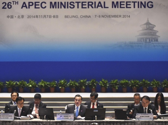 China's Foreign Minister Wang Yi (C) speaks at the start of Asia-Pacific Economic Cooperation (APEC) Summit ministerial meetings at the China National Convention Centre (CNCC) in Beijing, November 7, 2014. REUTERS/Greg Baker/Pool (CHINA - Tags: POLITICS BUSINESS)