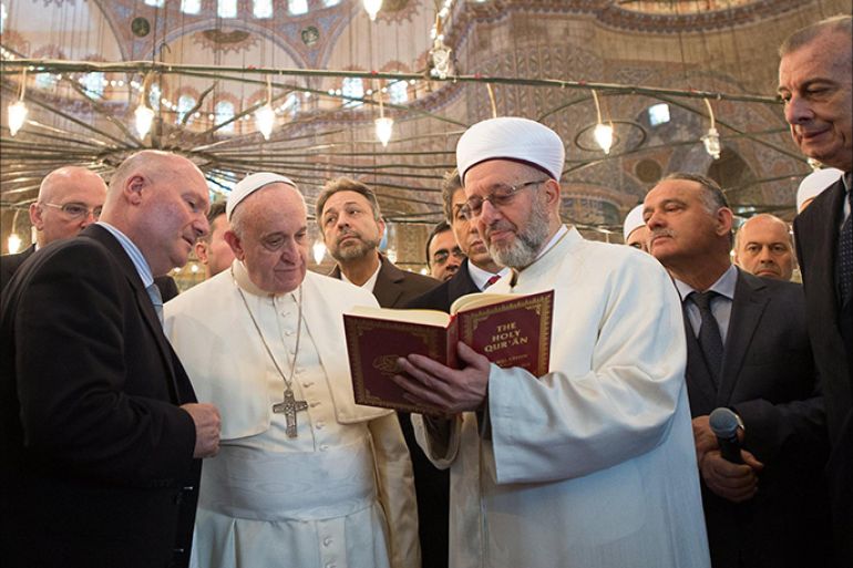 epa04508172 In this photo provided by Vatican newspaper L' Osservatore Romano, Pope Francis Pope Francis (L) is shown the Holy Quran by Mufti Rahmi Yaran during their visit to the Sultan Ahmed Mosque in Istanbul, 29 November 2014. The historic mosque - well known for its blue tiles adorning the interior walls - was built from 1609 till 1616. The pontiff concludes his visit 30 November when he will continue visiting key sites of the city's Byzantine and Ottoman heritage. EPA/OSSERVATORE ROMANO HANDOUT EDITORIAL USE ONLY/NO SALES