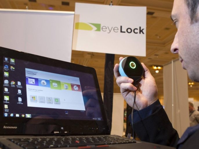 Tony Antolino, Chief Marketing Officer for EyeLock, demonstrates the Myris, a USB-powered iris scan, during Pepcom's "Digital Experience", a consumer electronics showcase, in Las Vegas, Nevada, January 6, 2014. The software converts iris characteristics to a unique code that can be used to unlock your computer. REUTERS/Steve Marcus (UNITED STATES - Tags: BUSINESS SCIENCE TECHNOLOGY)