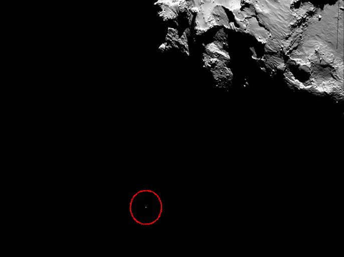 A handout photo released on November 13, 2014 by the European Space Agency shows Rosetta's wide-angle camera image capturing the position of lander Philae (circled) at 14:19:22 GMT (onboard spacecraft time). Europe's Rosetta spacecraft made contact with its robot craft Philae soon after the lander embarked on November 12 on a solo, seven-hour descent to a comet, ground controllers said. "Rosetta is receiving a signal from Philae," mission operations department head Paolo Ferri said at the European Space Agency (ESA) control centre in Darmstadt, Germany. Communications were re-established on schedule more than two hours after Philae set off at 0835 GMT for a 20-kilometre (12-mile) descent from the Rosetta orbiter, its home for the last decade. AFP PHOTO / HO / ESA/Rosetta/MPS for OSIRIS Team MPS/UPD/LAM/IAA/SSO/INTA/UPM/DASP/IDA = RESTRICTED TO EDITORIAL USE - MANDATORY CREDIT "AFP
