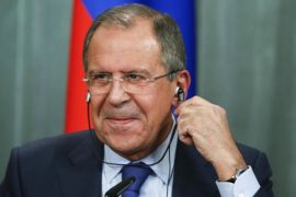 Russia's Foreign Minister Sergei Lavrov adjusts his headphones during a news conference after a meeting with his German counterpart Frank-Walter Steinmeier in Moscow, November 18, 2014. Lavrov said on Tuesday after holding talks with Germany's Frank-Walter Steinmeier that Kiev and east Ukraine's rebel regions must establish sustainable dialogue taking into account elections held on both territories. REUTERS/Sergei Karpukhin (RUSSIA - Tags: POLITICS)